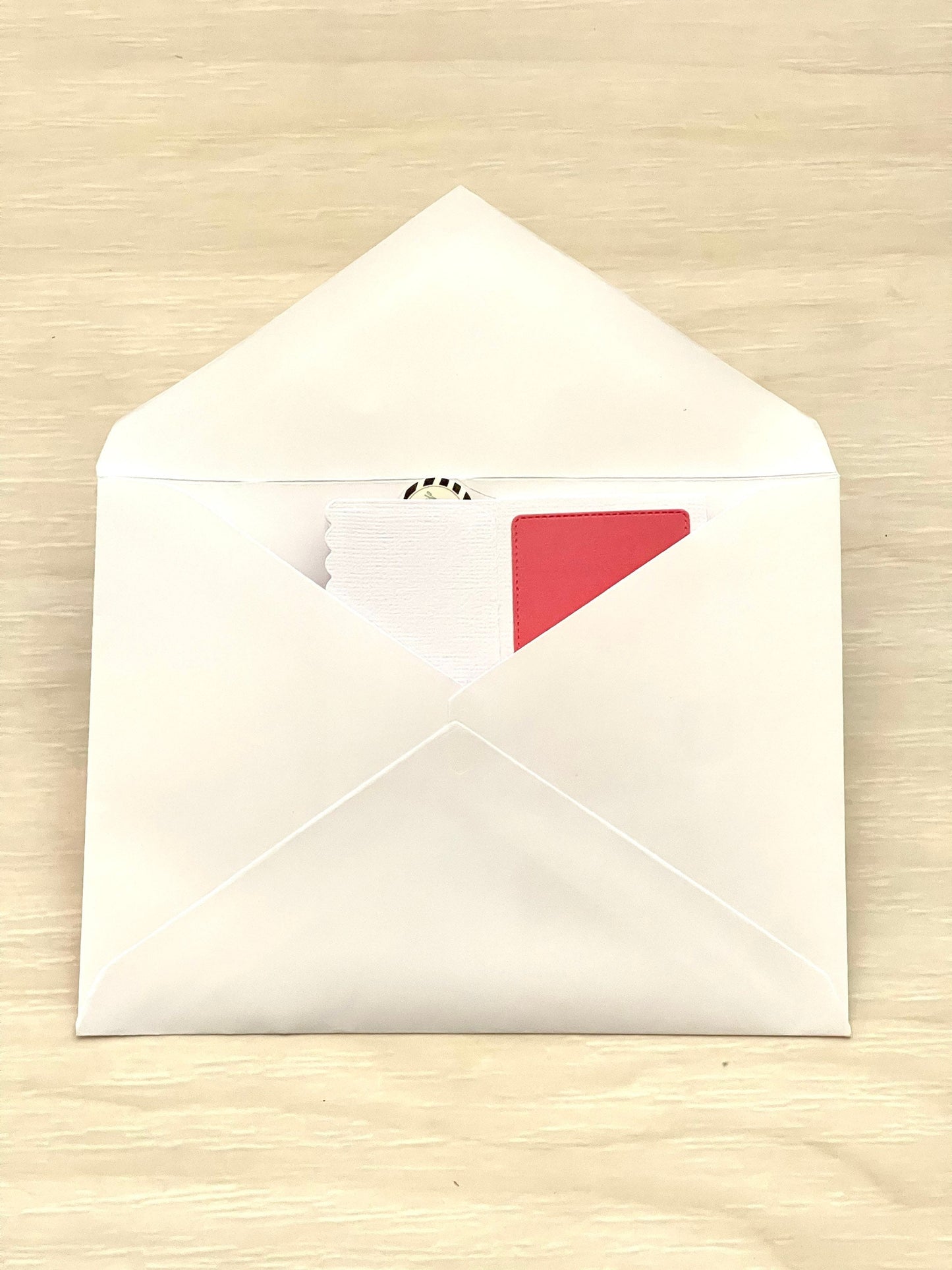 White envelope on a beige surface
