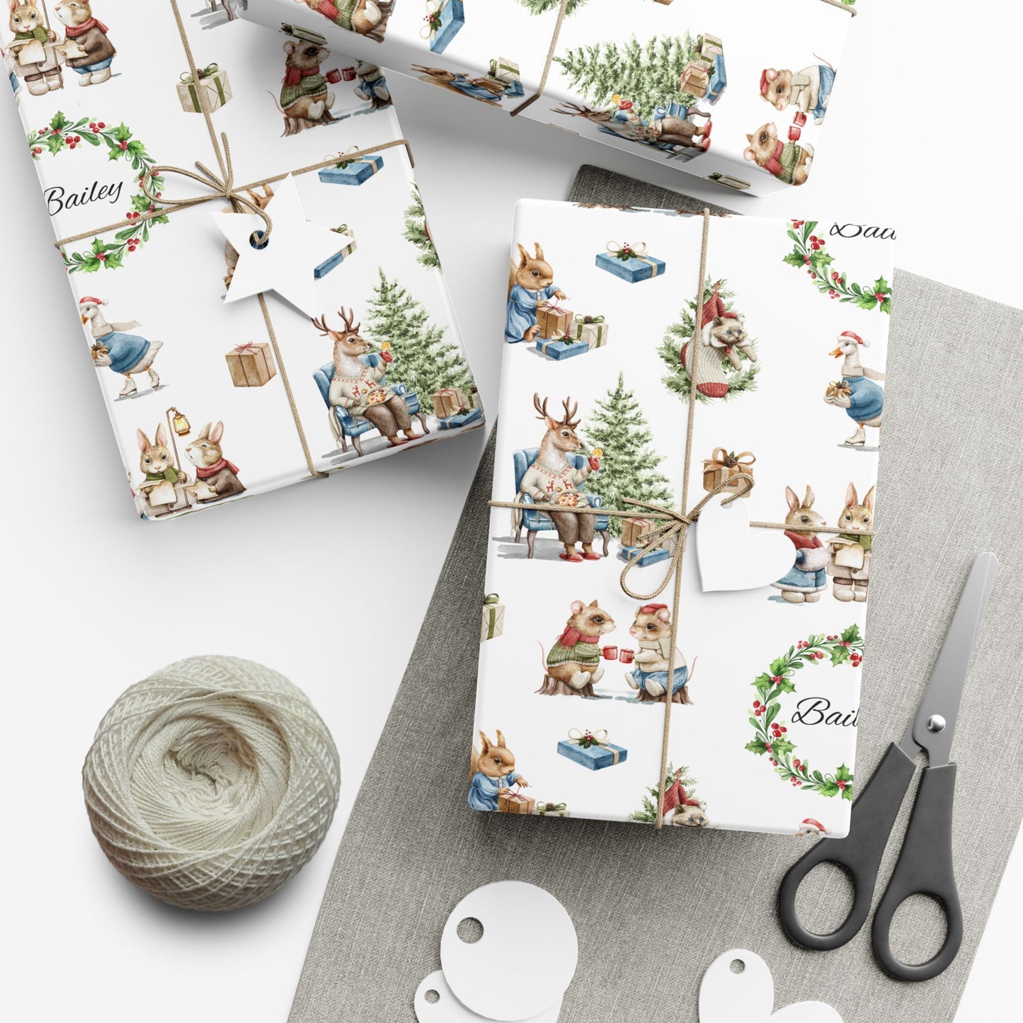 Christmas-themed gift wrap with festive illustrations, scissors, and yarn on a white background