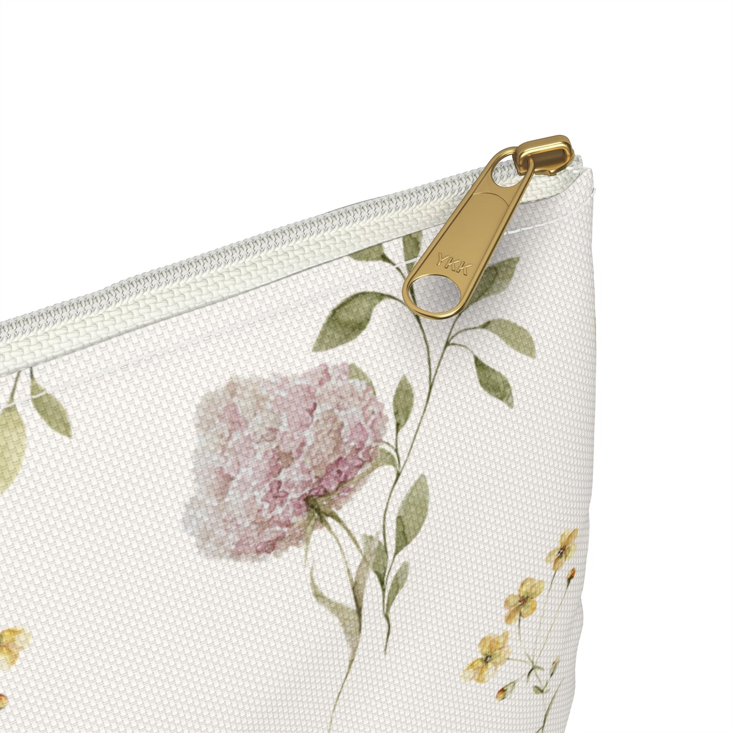 Floral-patterned pouch with a gold zipper on a white background