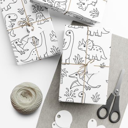 Two wrapped packages with dinosaur patterns, a ball of yarn, and scissors on a white surface.