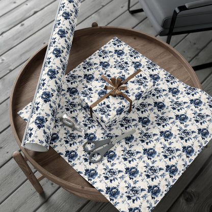 Floral-patterned gift wrap with scissors on a wooden table