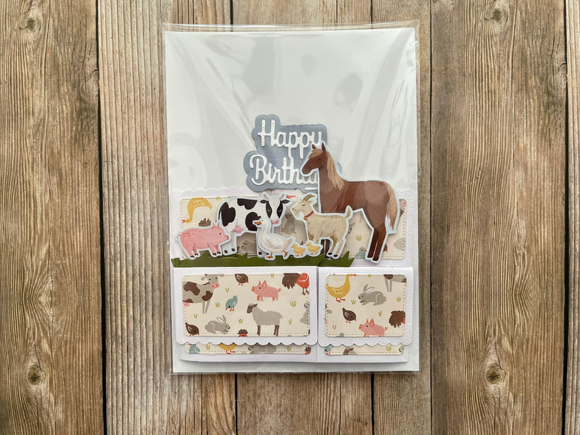 Birthday card with animal illustrations on a wooden background