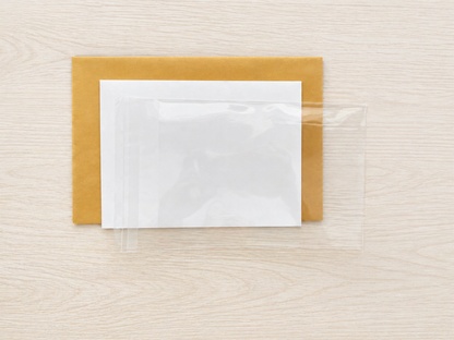 Cellophane envelope, white envelope and mailing envelope for cards.