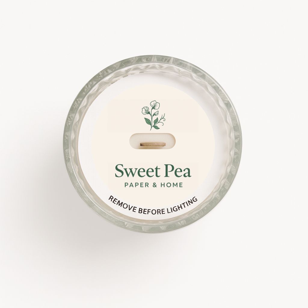 Candle with 'Sweet Pea' branding on a white background