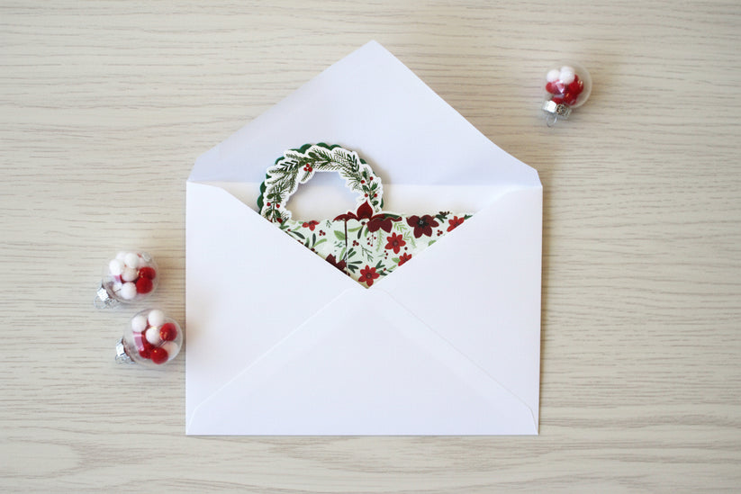 White envelope with pop-up greeting card inside.
