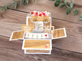 Wooden toy truck with flowers and 'Love you' message on a wooden surface