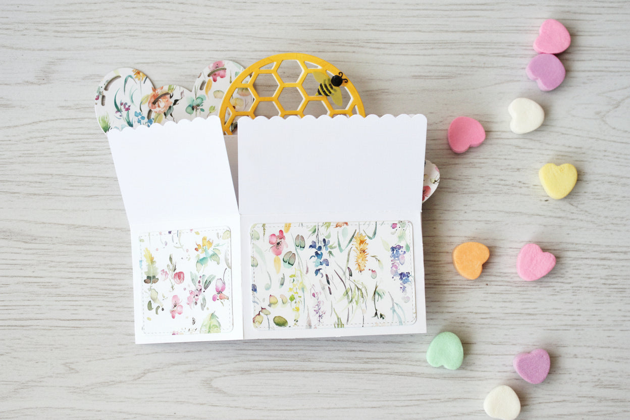 Valentine's Day box style pop-up card with bee theme, folded on a white wooden surface.