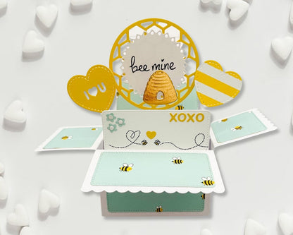 Pop-up card with bee design and 'bee mine' text on a white background