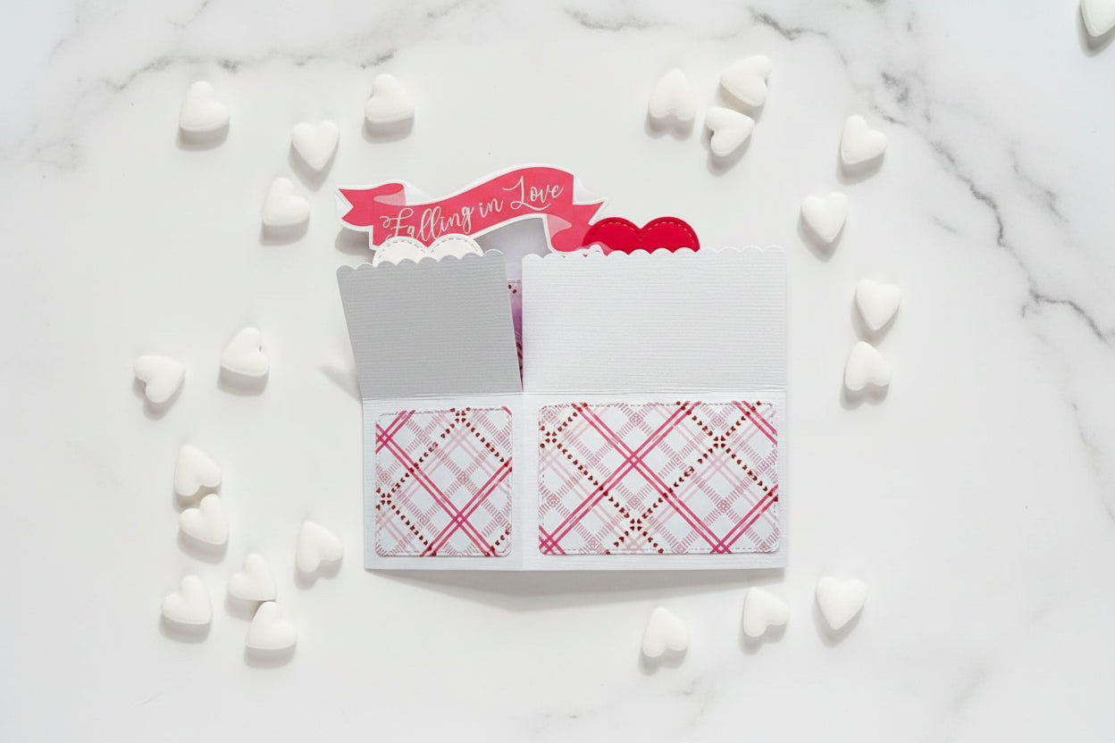 Notebook with plaid patterns and a 'Falling in Love' banner on a white background