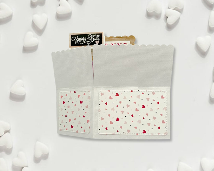 Notebook with heart pattern on a white background with heart-shaped objects