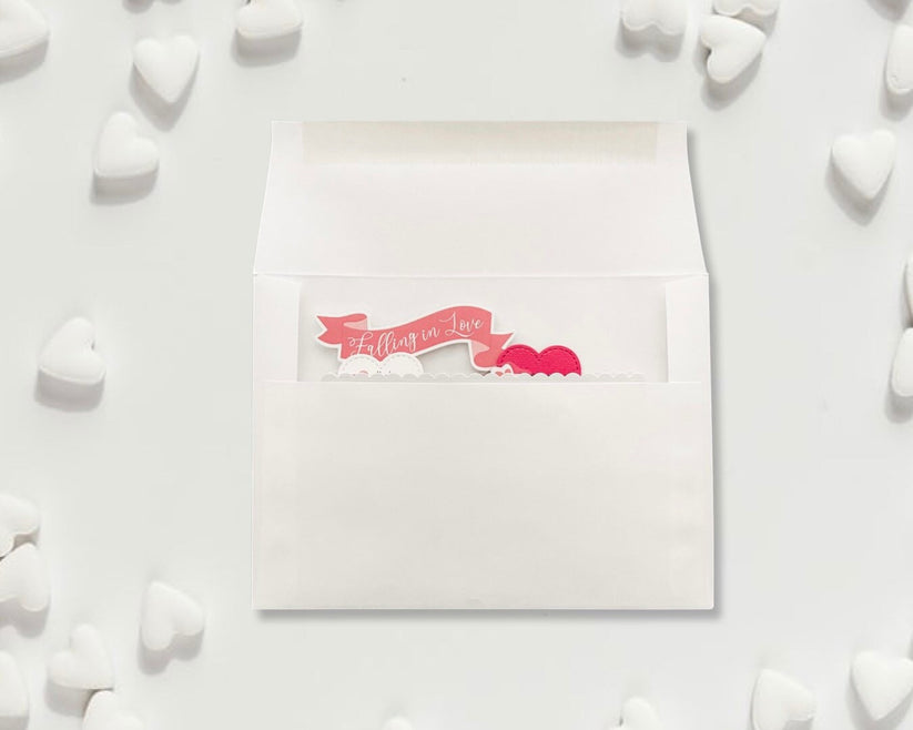White card with pink text and hearts on a white background