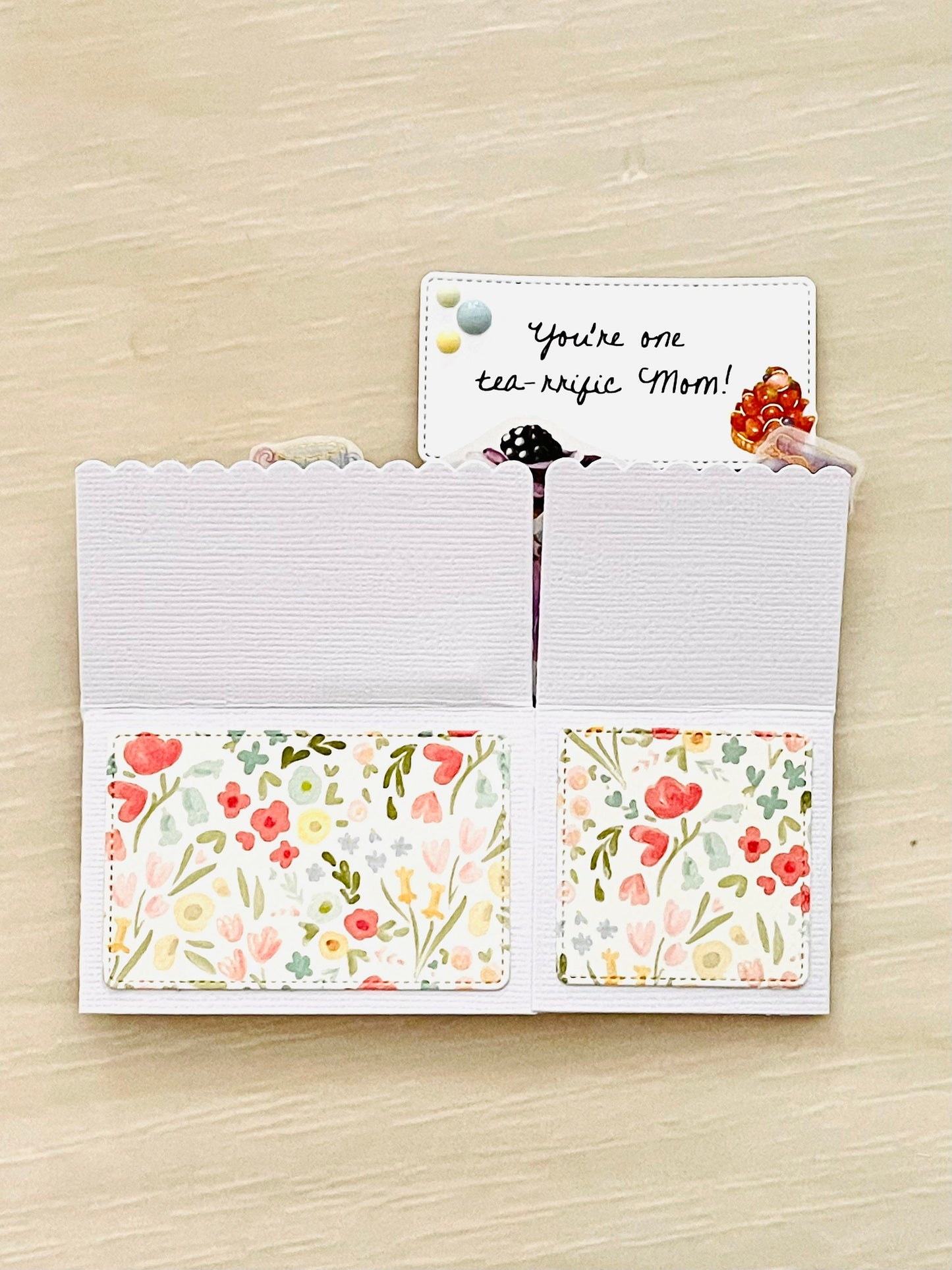 Mother's day pop-up card with tea party theme.  Floral accents and message of You're one tea-rrific mom.
