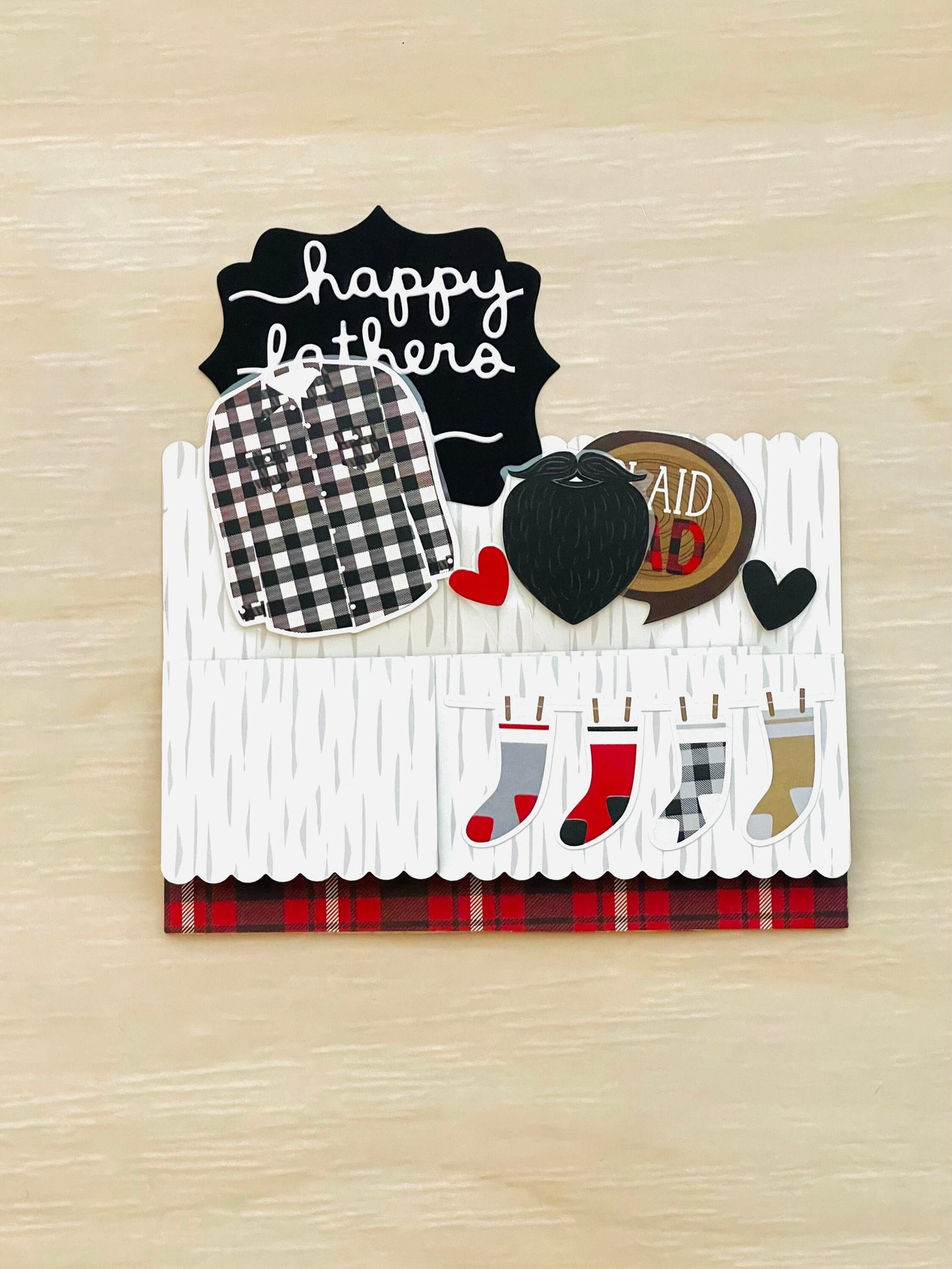Decorative card with Father's Day elements on a wooden surface
