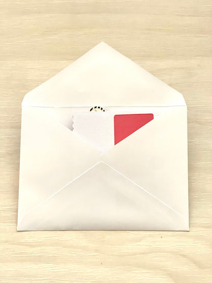 White envelope on a beige surface