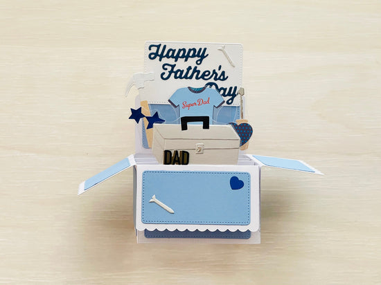 A 3D box pop-up card for Father's Day in blue and white, showing tools.