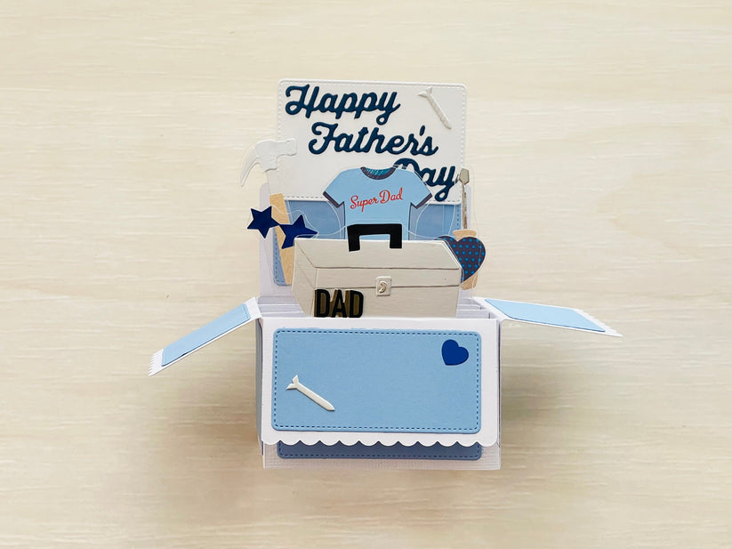 A 3D box pop-up card for Father's Day in blue and white, showing tools.