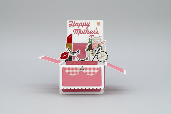 Pop-up card with 'Happy Mother's Day' text and cosmetic-themed elements on a beige background