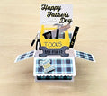 Pop-up Father's Day card with toolbox design on a wooden surface