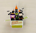 Halloween-themed pop-up card with cartoon characters and a castle on a beige background