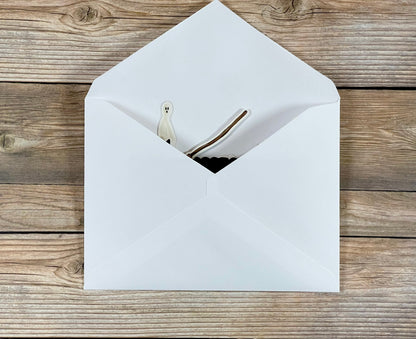 White envelope on a wooden surface