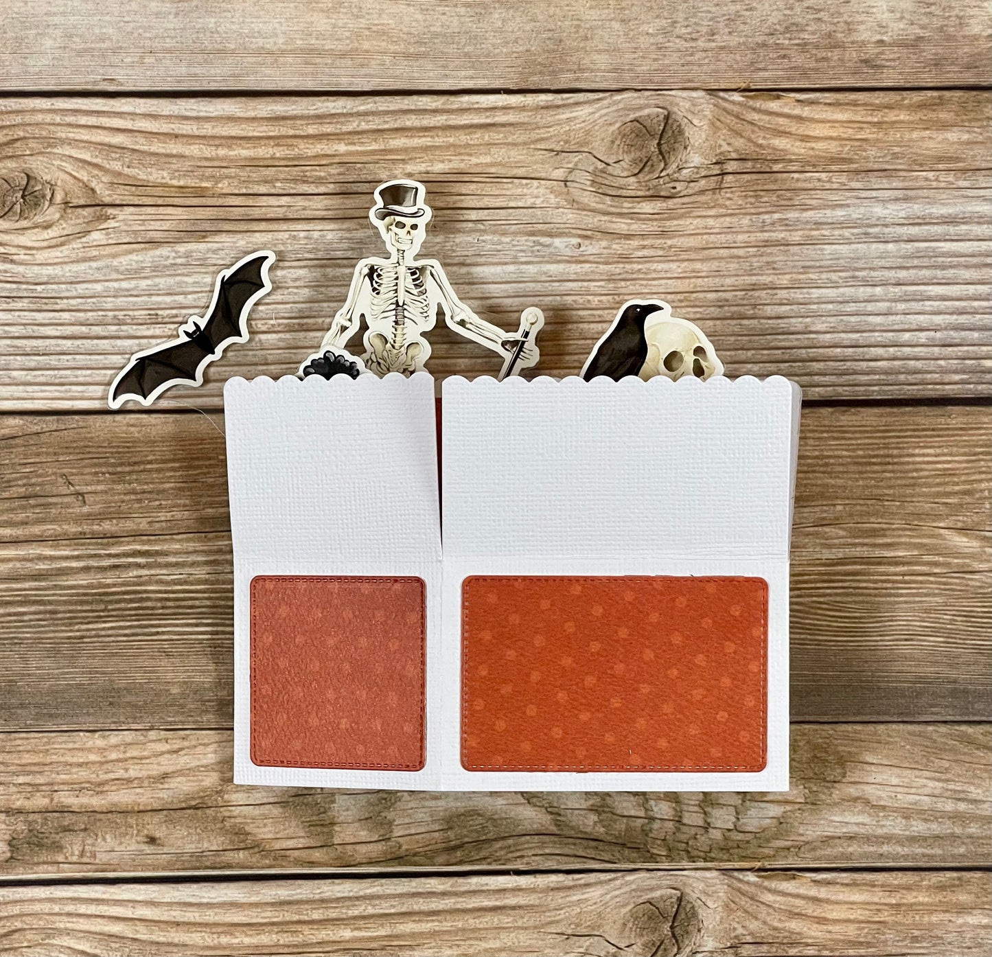 Makeup palette with Halloween-themed design on a wooden background