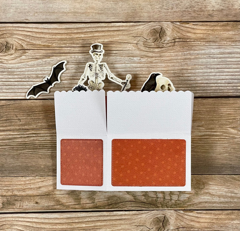 Makeup palette with Halloween-themed design on a wooden background