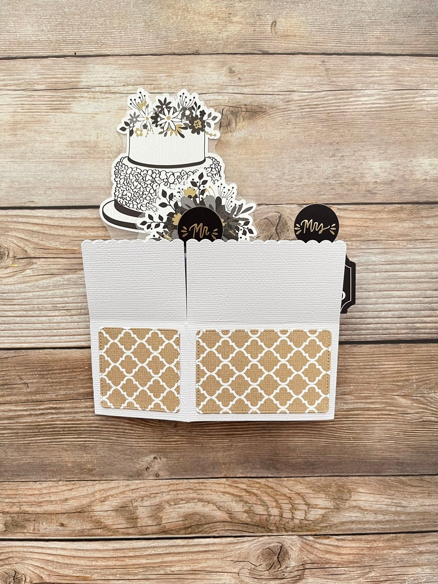 Decorative card with a cake on a wooden surface