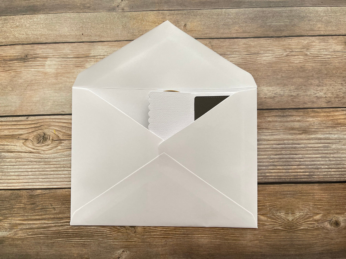 White envelope on a wooden surface