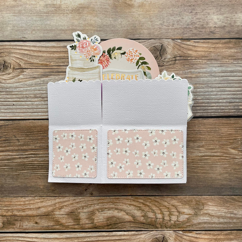 Floral design card on a wooden surface