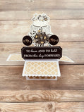Pop-up card showing a wedding cake with floral design and text on a wooden background
