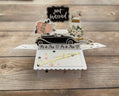 Pop-up card with wedding car and 'Just Married' text on a wooden background