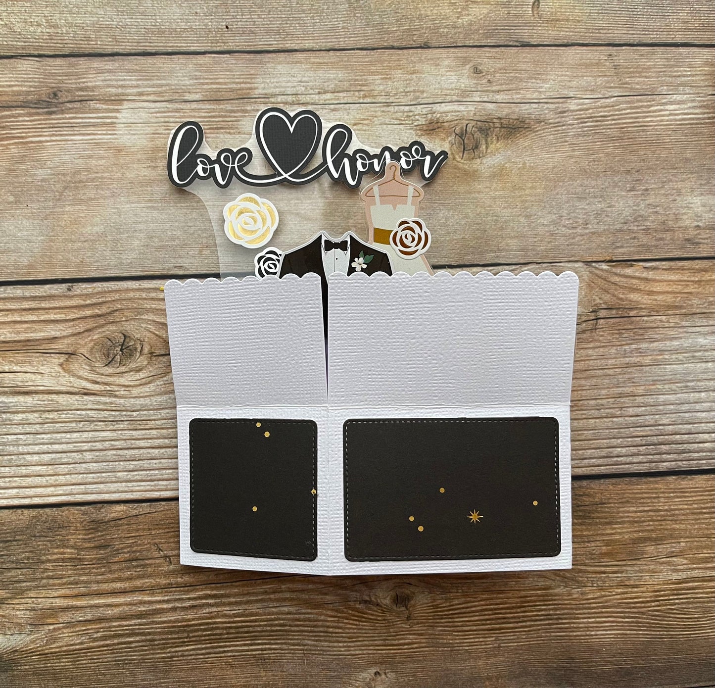 Decorative card with 'love honor' text on a wooden surface