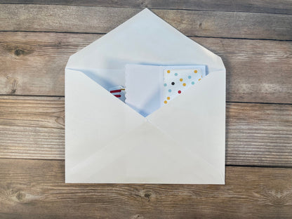 Open envelope with a letter inside on a wooden surface