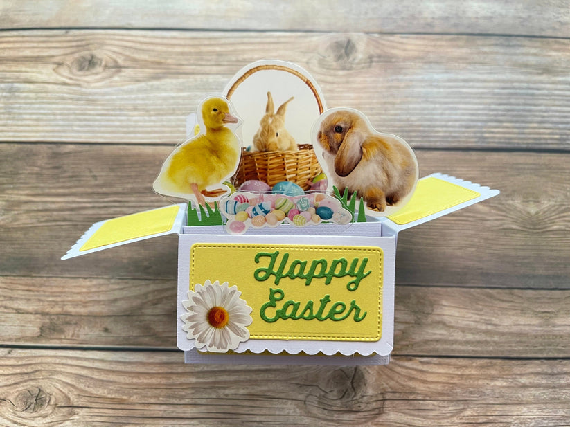 Easter-themed box style pop-up card with a duck, rabbit, and basket on a wooden background