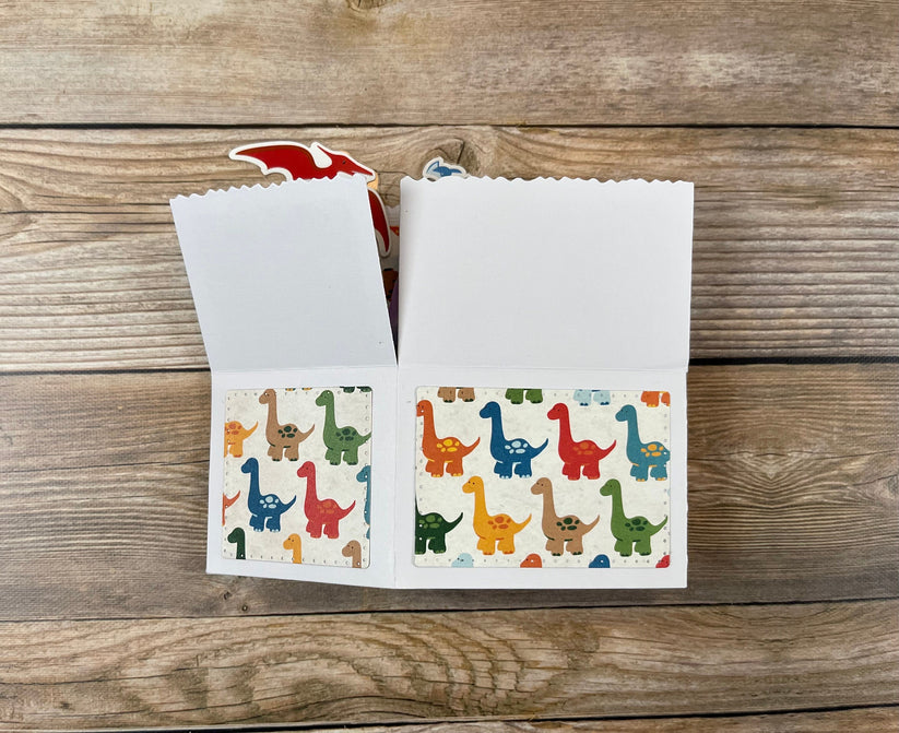 
Folded pop-up card with dinosaur theme