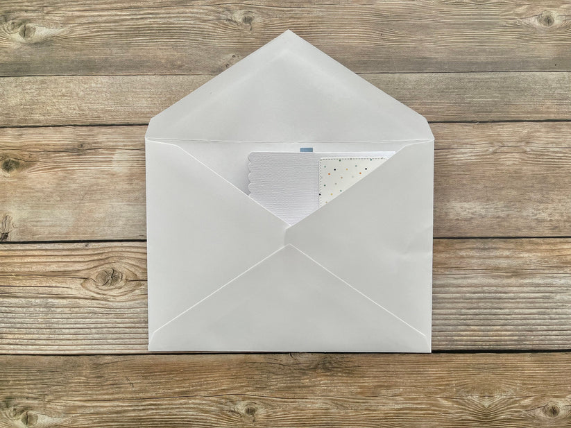 White envelope on a wooden surface