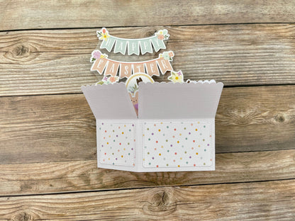 Decorative card with a small banner on a wooden surface