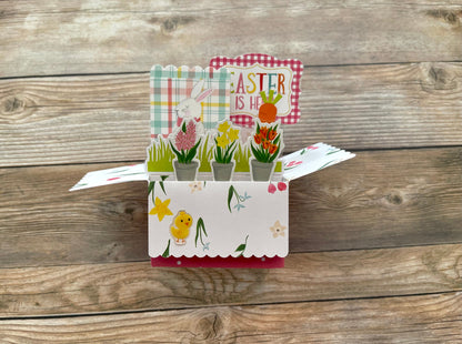 Easter-themed pop-up card on a wooden surface