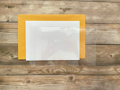 Clear plastic sheet on a wooden surface with a yellow border