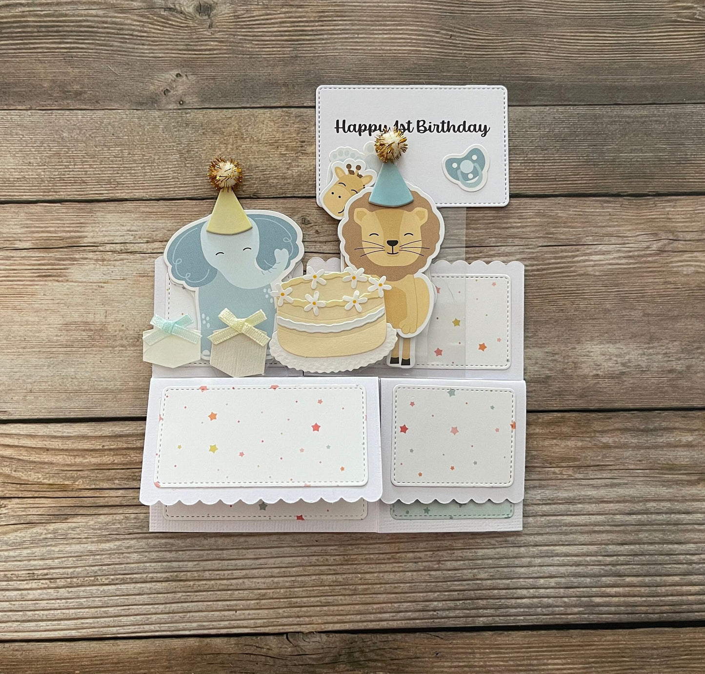 Children's birthday card with animal illustrations on a wooden surface