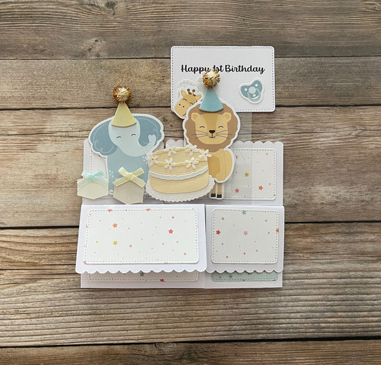 Children's birthday card with animal illustrations on a wooden surface