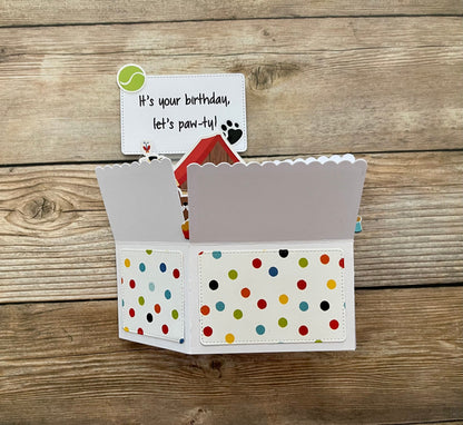 Polka dot card with birthday message on a wooden background