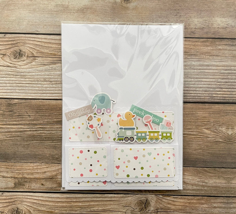 3D box pop-up baby card shown in cellophane package.