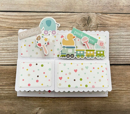 Baby pop-up card with cute toys and message of Oh, baby.
