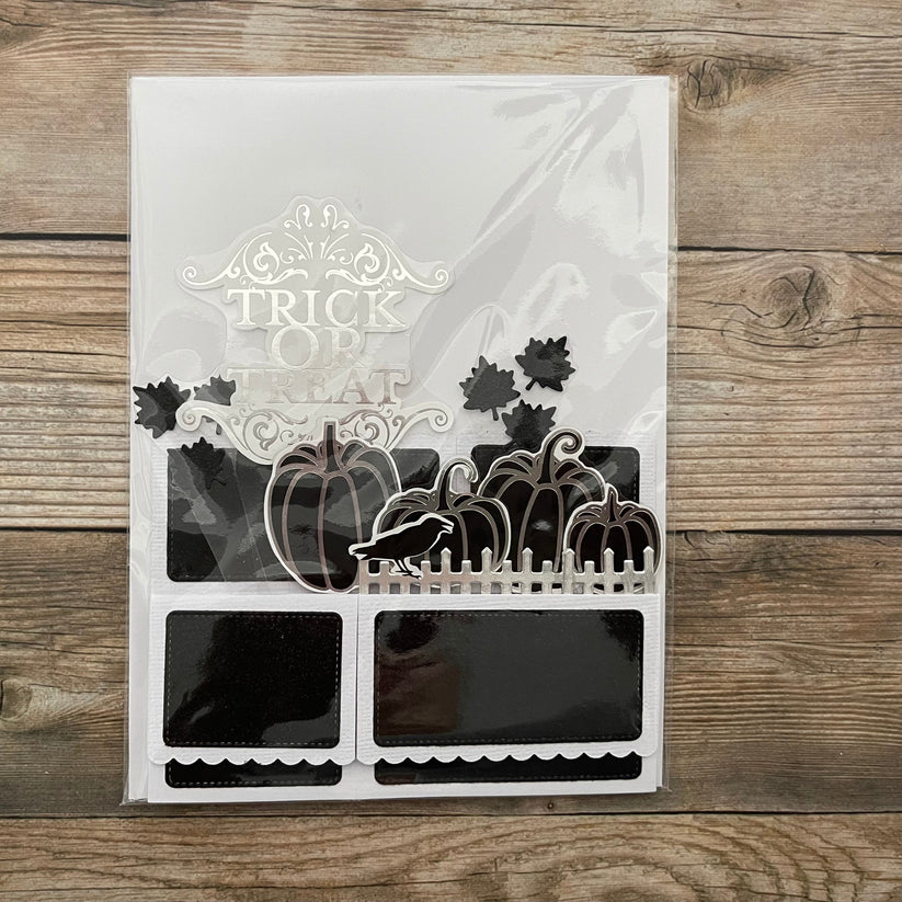 Halloween-themed die-cut set with 'Trick or Treat' text on a wooden surface