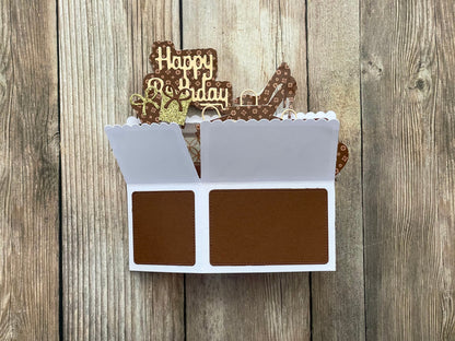 Decorative birthday card with chocolate-themed design on a wooden background