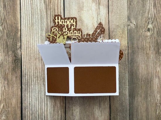 Decorative birthday card with chocolate-themed design on a wooden background