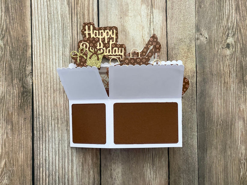 Decorative birthday card with chocolate-themed design on a wooden background