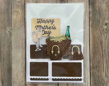 Card with 'Happy Mother's Day' text, champagne glasses, a bottle, and handbags on a wooden background
