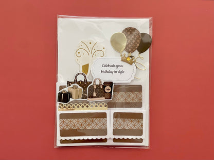 Decorative birthday card with shopping bag, cake, and balloon designs on a red background